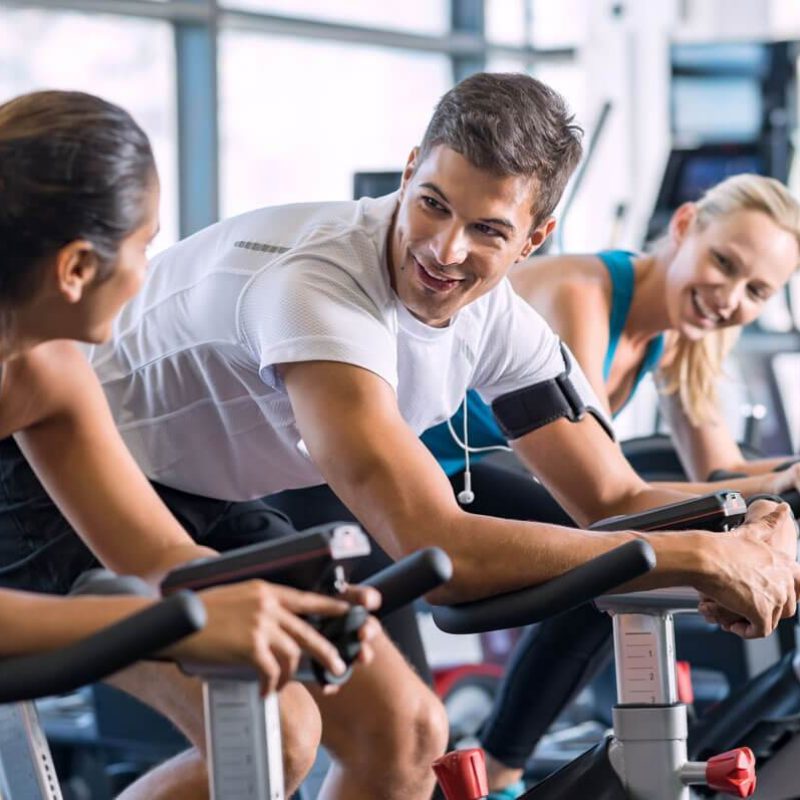 fit-people-cycling-at-gym-PJNFP5E.jpg